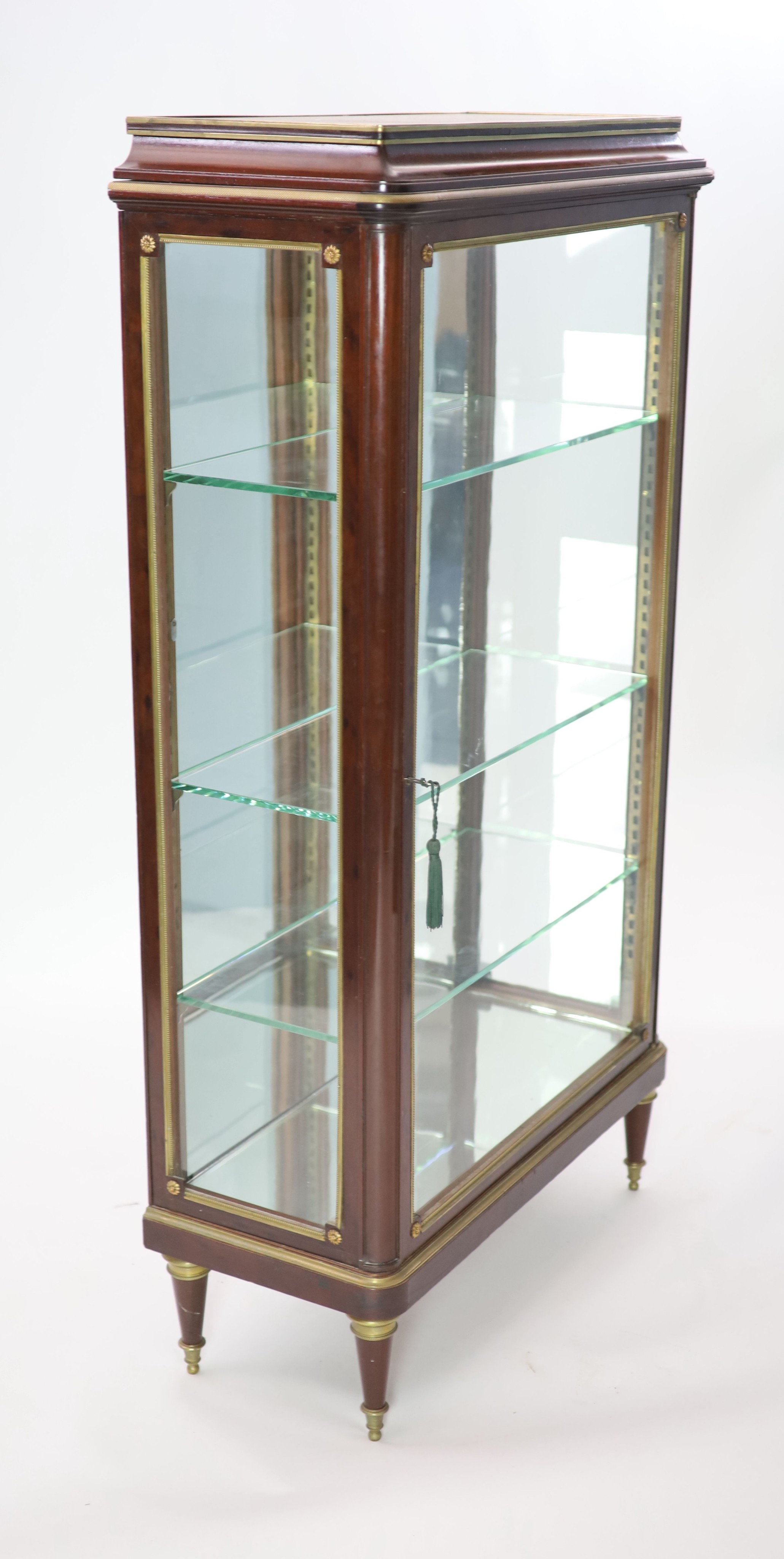 An early 20th century French ormolu mounted mahogany vitrine H 147cm. W 81cm. D 35cm.
